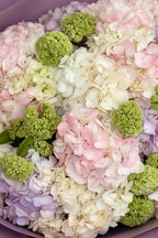 IN𝓃 Floral Studio mixed hydrangea bouquet in pastel pink, lavender, ivory, and blush with green viburnum accents. Size M.