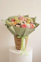IN𝓃 Floral Studio Soft Atelier bouquet with pink roses, peach roses, chrysanthemums, stock, and hydrangeas.